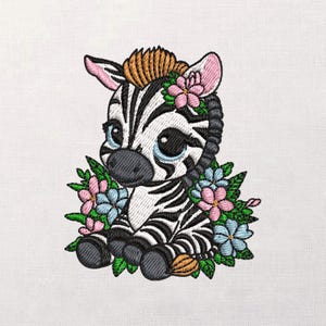 May include: An embroidered design of a cute zebra with black and white stripes, large blue eyes, and pink ears. The zebra is adorned with a floral crown and surrounded by pink and blue flowers and green leaves.