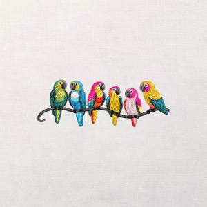 May include: Embroidered design of six colorful parrots perched on a curved, dark brown branch. The parrots feature vibrant hues of green, blue, yellow, pink, and red. The background is a plain white fabric.