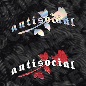 May include: Two "antisocial" rose designs on a black background. The top design features iridescent text and a rose with a stem and leaves. The bottom design has red glitter text and a red glitter rose.