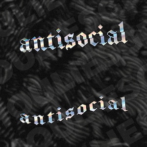 May include: Two instances of the word "antisocial" in a holographic, gothic-style font are displayed against a dark, textured background. The text appears to have a shimmering, iridescent quality, with colors shifting across the letters.