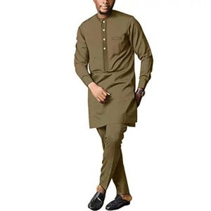 May include: A two-piece olive green outfit. The long-sleeved top has a mandarin collar and button closure. The matching pants are tailored. The outfit is worn with black loafers and a watch.