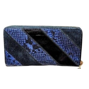 May include: A rectangular wallet with a zipper closure. The wallet features a combination of black suede and blue snakeskin-patterned leather. The zipper pull is gold-colored.