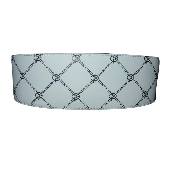 May include: A white belt with a repeating black diamond pattern. Each diamond contains the word "VALENTINO ORLANDI" in a black, stylized font. The belt is made of a smooth material and has a stitched edge.