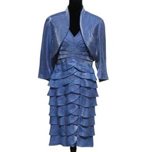 May include: A formal blue dress and matching bolero jacket. The dress features a V-neck and a tiered skirt. The bolero has three-quarter sleeves. The outfit is displayed on a black mannequin.
