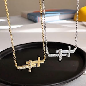 May include: A set of three ceramic mugs with a speckled, matte finish. The mugs are in shades of cream, light gray, and dark gray. Each mug has a simple, minimalist design, perfect for coffee or tea.