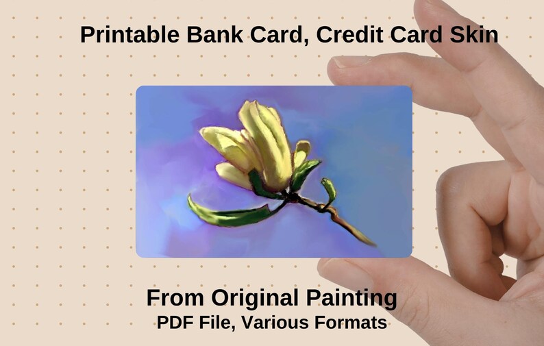 May include: A printable bank card skin featuring a floral design. The card displays a yellow flower with green leaves against a blue and purple background. The text "Printable Bank Card, Credit Card Skin" is at the top.