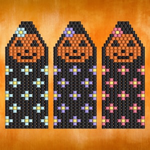May include: Three vertical beaded patterns featuring a jack-o'-lantern face at the top with orange and black beads. The lower sections are black with repeating flower motifs in light blue, light purple, and pink, respectively.