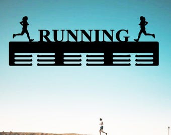 May include: Black metal medal display rack with the word "RUNNING" and two running figures. The rack has eight slots for medals.