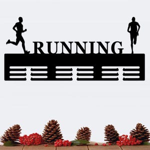 May include: Black metal medal display rack with the word "RUNNING" in large letters and two running figures. The rack has 12 slots for medals.