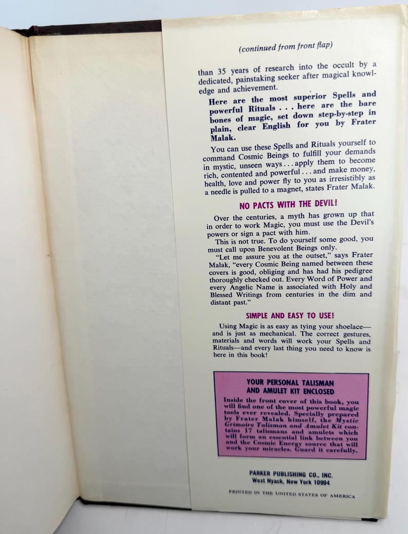 May include: Open book page with text about spells, rituals, and magic by Frater Malak. The text includes phrases like "Cosmic Beings," "Talisman and Amulet Kit," and "Parker Publishing Co." The book is printed in the United States of America.