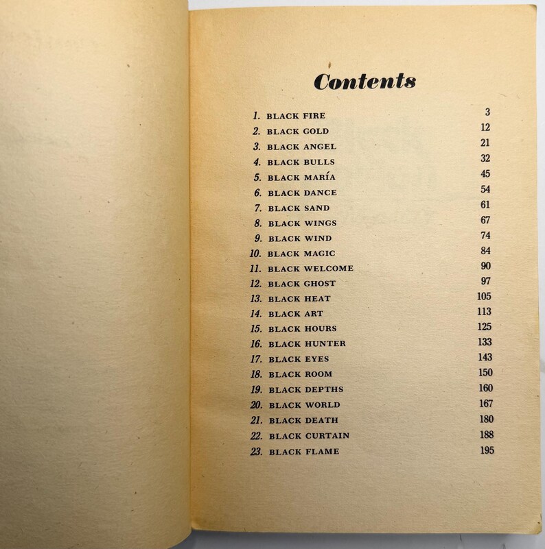 May include: Open book page with the title "Contents" in a stylized font. The page lists numbered chapter titles such as "BLACK FIRE," "BLACK GOLD," and "BLACK ANGEL," with corresponding page numbers. The paper has a yellowed, aged appearance.