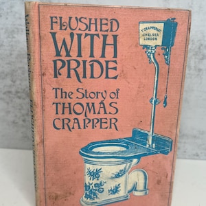 May include: A vintage book titled "Flushed With Pride" with a pink cover and blue text and illustrations. The book's subtitle is "The Story of Thomas Crapper." The cover features a diagram of a toilet.