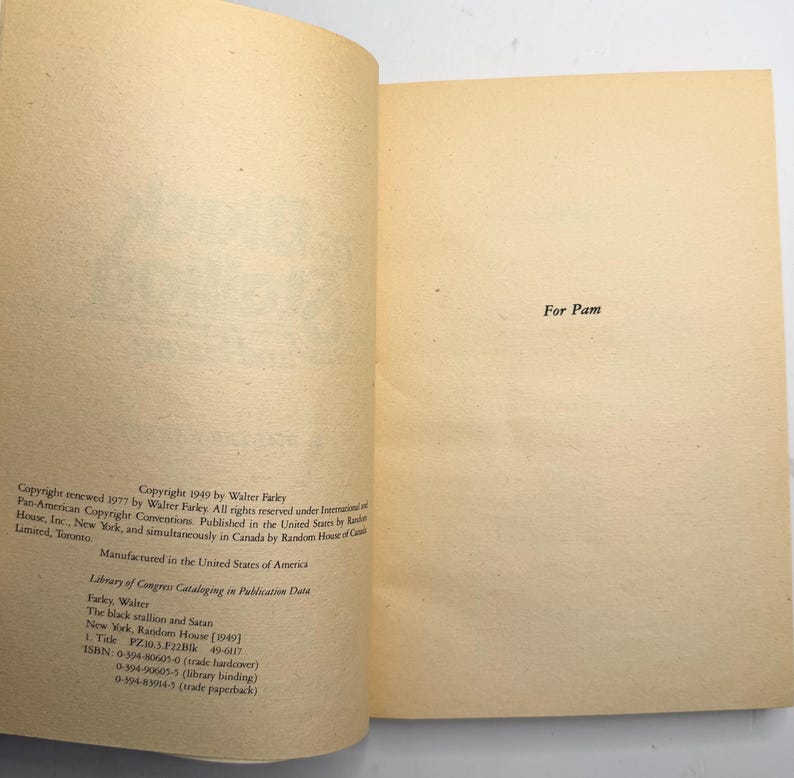 May include: Open book with aged, cream-colored pages. The text "For Pam" is centered on the right page. The left page contains copyright information, including the author's name, the title, and the publisher.