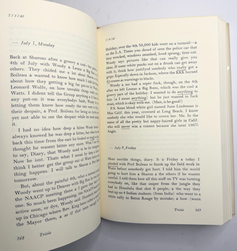 May include: An open book with handwritten diary entries. The pages are aged, with visible text and dates. The text contains references to events and personal reflections. The book is open to pages 168 and 169.