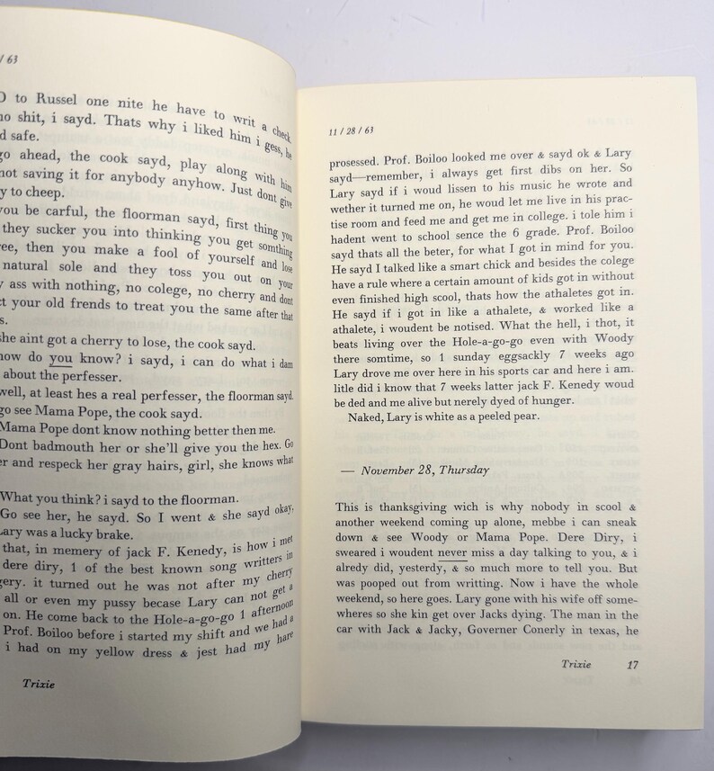 May include: An open book with text on the pages. The left page has a paragraph starting with "O to Russel one nite he have to write a check". The right page has text starting with "possessed. Prof. Boiloo looked me over & sayd ok & Lary sayd".