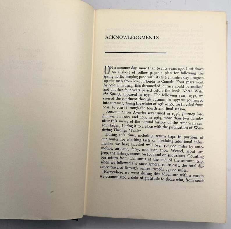 May include: Open book with text titled "ACKNOWLEDGMENTS." The text describes a journey across America, mentioning travel by various modes, including automobile, airplane, and canoe. The text also mentions the book "North With the Spring."