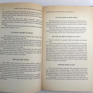 May include: Open book pages with text about magic and miracles. The text includes phrases like "The Whole Secret of Magic" and "Miracles Are Yours". The pages are yellowed with age.