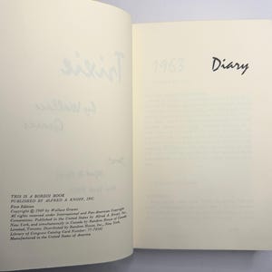 May include: An open book with text on the pages. The right page has the word "Diary" and the year "1963". The left page has handwritten text and the words "This is a Borzoi Book" and "Published by Alfred A. Knopf, Inc."