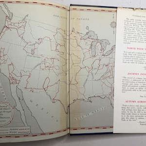May include: Open book with a map of North America and Mexico, featuring red lines indicating routes. The text "The Routes of Edwin Way Teale's Journeys through the Four American Seasons" is visible. A bookmark with text is inserted.
