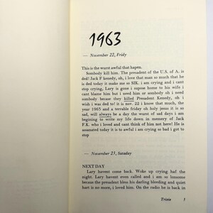 May include: An open book showing handwritten diary entries from 1963, dated November 22 and 23. The text details personal reactions to the assassination of President Kennedy. The page is from a diary or journal.