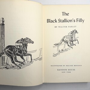 May include: An open book with the title "The Black Stallion's Filly" by Walter Farley. Illustrations by Milton Menasco. The book features black and white drawings of racehorses and jockeys in action. Published by Random House, New York.