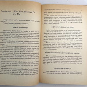 May include: Open book with text on aged paper. The left page has an introduction about what the book can do, and the right page discusses magic and the devil. The book is about magic and grimoires.
