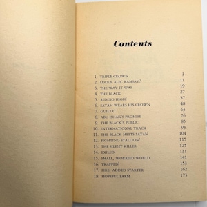May include: Open book with a contents page. The title "Contents" is at the top, followed by a list of chapter titles and page numbers. The pages are off-white with black text.