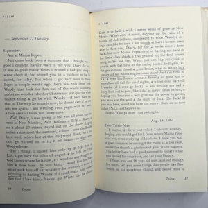 May include: An open book with handwritten text on aged paper. The text includes dates, personal reflections, and mentions of places like New Mexico and Hollywood Bowl. The pages are yellowed, suggesting age.