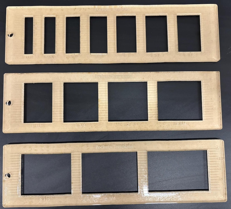May include: Three clear plastic frames with different sized rectangular openings. The frames are labeled "Pocket Templates".