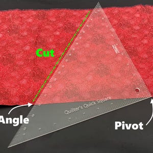 May include: A clear plastic quilting ruler with the words "Quilter's Quick Square" printed on it. The ruler is placed on top of a red fabric with a white floral pattern. The ruler is angled and a green dashed line is drawn along the ruler to show the cut line. The words "Cut", "Angle", and "Pivot" are written in green on the image.