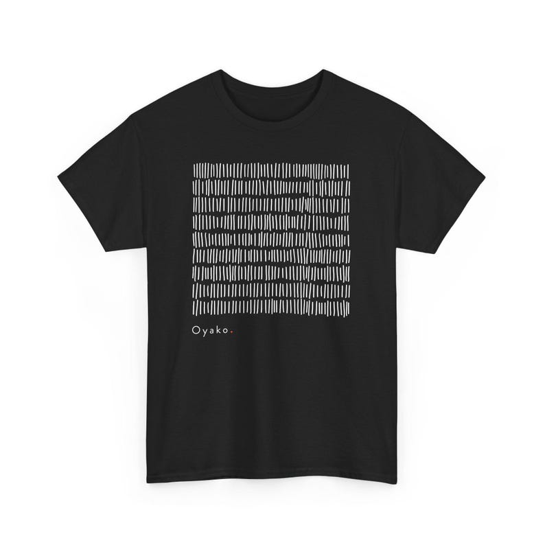 May include: Black t-shirt featuring a white abstract design of vertical lines. The word "Oyako" is printed in white at the bottom left of the shirt. The shirt has short sleeves and a crew neck.