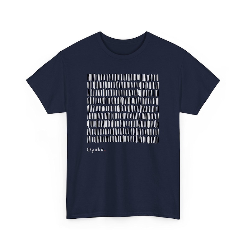 May include: Navy blue t-shirt with a white abstract design of vertical lines arranged in a grid pattern. The word "Oyako." is printed in white below the design. The shirt is a short-sleeved crew neck.