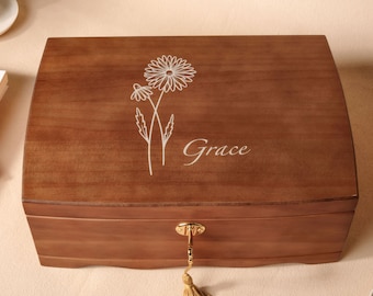 May include: A wooden jewelry box with a key and tassel. The lid is engraved with a floral design and the word "Grace".
