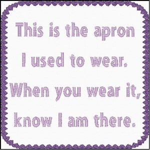 May include: A white fabric square with a purple border and the text "This is the apron I used to wear. When you wear it, know I am there."