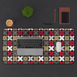 May include: Desk mat with a floral pattern in red, white, gold, and grey on a black background. A laptop, mouse, and stationery are arranged on the mat, creating a workspace. The mat measures approximately 80 cm in length.