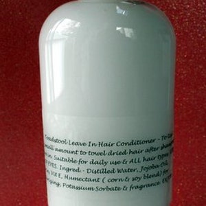 May include: White plastic bottle with a black label that reads "Toadstool Leave In Hair Conditioner - To use a small amount to towel dried hair after shower. Suitable for daily use to ALL hair types. Ingred. Distilled Water, Jojoba Oil, Vit. E, Humectant (corn & soy blend for synergy, Potassium Sorbate & fragrance."
