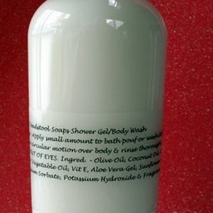 May include: A clear plastic bottle of body wash with a white label. The label has black text that reads "mdytool Soapy Shower Gel/Body Wash apply small amount to bath/pour or wash circular motion over body & rinse thoroughly OUT OF EYES. Ingred: Olive Oil, Coconut Oil Vegetable Oil, Vit E, Aloe Vera Gel, Sunflower Sorbate, Potassium Hydroxide & Fragrance"