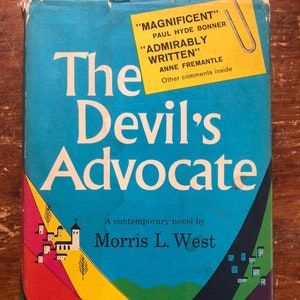 May include: The Devil's Advocate, a contemporary novel by Morris L. West. The book cover features a colorful abstract design with a blue sky and a church in a small town.