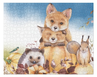 May include: A watercolor illustration of a fox family with a hedgehog and a squirrel. The foxes are stacked on top of each other, with the mother fox on top and the baby fox on the bottom. The hedgehog is sitting in front of the foxes, and the squirrel is sitting on the right side of the image. The animals are all surrounded by fall leaves and pumpkins.