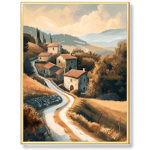 Könnte beinhalten: Ein gerahmter Kunstdruck zeigt eine ländliche Landschaft mit einer kurvenreichen Straße und Steinhäusern. Das Kunstwerk zeigt ein Dorf mit roten Ziegeldächern, umgeben von Bäumen und sanften Hügeln. Die Farbpalette umfasst warme Töne von Braun, Beige und Grün.