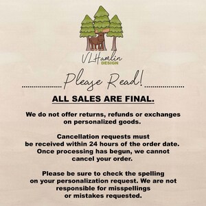 a white sign with a picture of a cow and trees on it