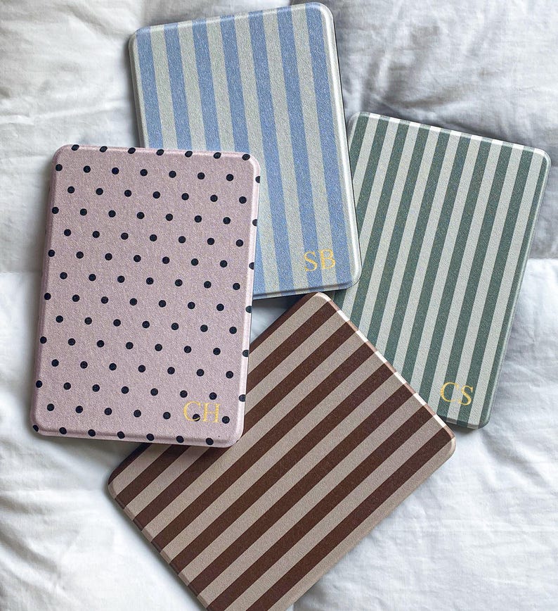 Personalized Kindle case set featuring retro stripe and polka dot designs. Custom monogram Kindle cover in blue stripe, sage stripe, pink polka dot and brown stripe styles. Stylish bookish Kindle Paperwhite cover compatible with Kindle 2024 and Colorsoft models.
