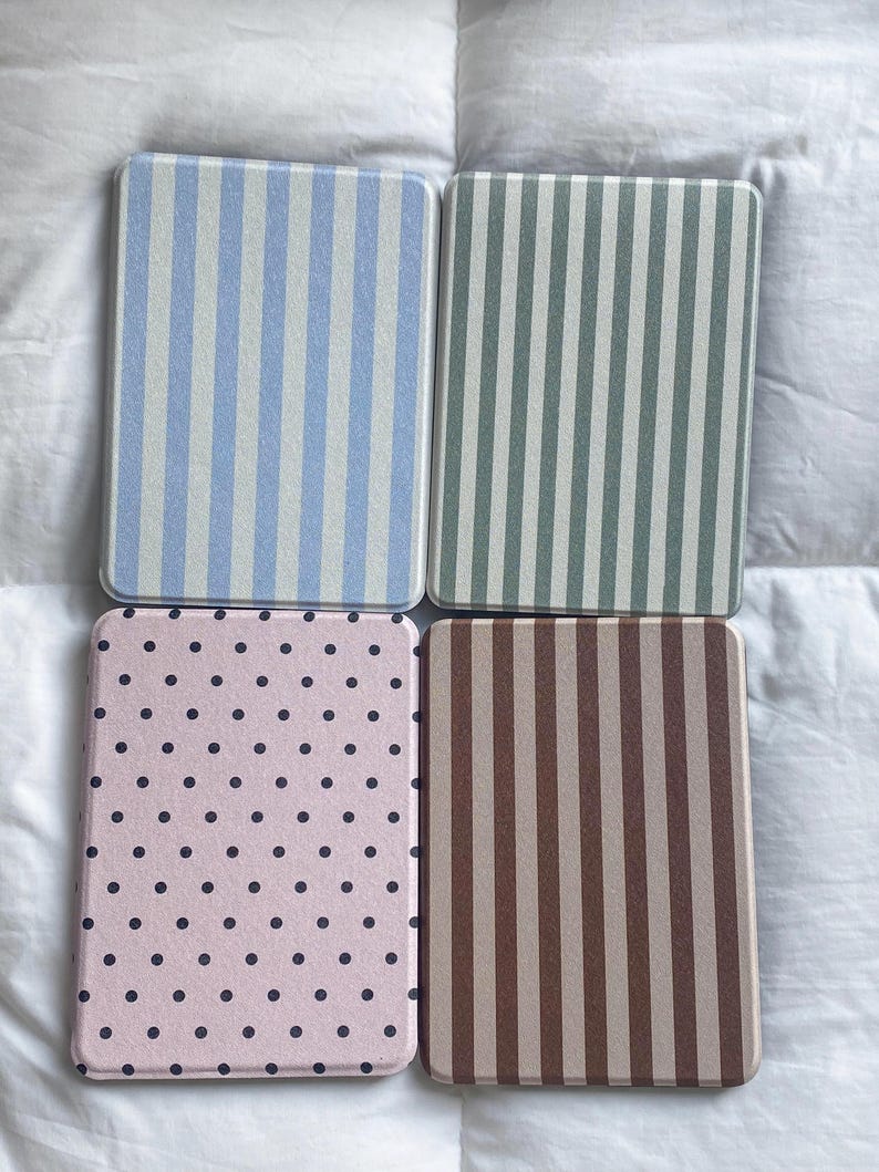 Retro patterned Kindle case collection showing Blue Stripe, Sage Stripe, Pink Polka Dot and Brown Stripe designs. Personalized Kindle cover styles for book lovers, compatible with Kindle Paperwhite, Kindle 2024 and Kindle Colorsoft devices.