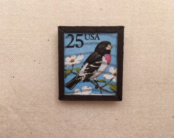 Framed birdie postage stamp