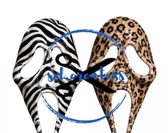 May include: Two ghost-style masks side by side. The left mask features a black and white zebra stripe pattern. The right mask features a brown and black leopard print pattern. A black scissor icon and the blue text "sol.createss" are overlaid.