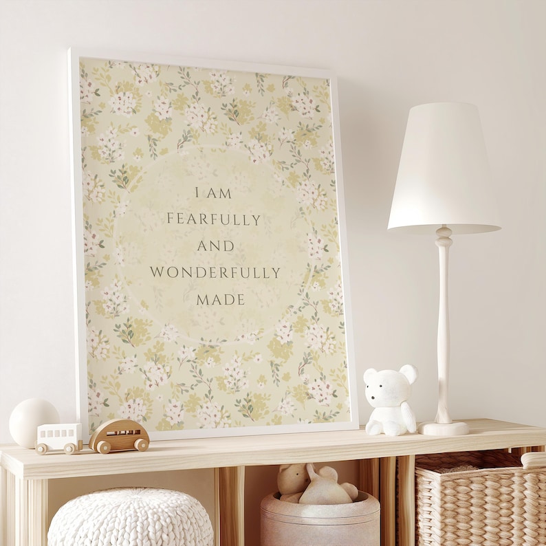 May include: A framed print with a floral pattern and the text "I am fearfully and wonderfully made" in a circle in the center.