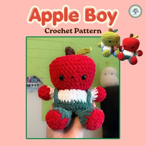 May include: A crochet plush toy shaped like a boy with a red apple head, white shirt, and dark green overalls. The text Apple Boy Crochet Pattern is displayed above. Two smaller versions of the plush in green and red are shown in the corner.