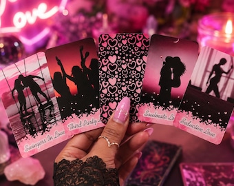 May include: A set of five rectangular oracle cards featuring pink and black silhouettes of couples and groups. The cards display text labels including Swingers In Love, Third Party, Soulmate Love, and Seductive Love, with one card showing a heart pattern.