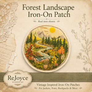 May include: A circular iron-on patch featuring an embroidered forest landscape with a winding river, evergreen trees, mountains, and a yellow sun. The text reads Forest Landscape Iron-On Patch, ReJoyce Studio AZ, and Vintage Inspired Iron-On Patches.