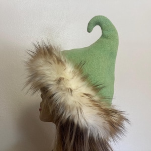 May include: A rustic wooden sign with the text "Welcome to our home" in a handwritten style. The sign features a distressed finish and a simple, inviting design, perfect for a front porch or entryway.